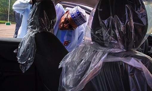 Buhari admires a Made In Nigeria Peugeot car copy