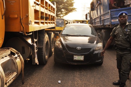 Vehicles impounded by Lagos State Governor’s convoy, for driving against traffic at Ijora, on Wednesday, December 16, 2015.