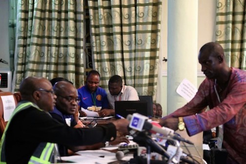 R-L: Returning Officer of Yenagoa LG presenting his report to the REC, Prof Zana Akpgu. Photo: Idowu Ogunleye