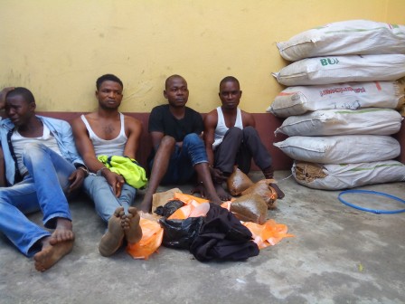 The suspects and some of the bags of Indian hemp recovered from their hideout