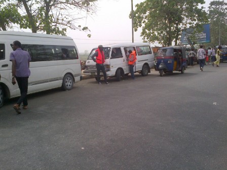 INEC adhoc staff in hired buses ready to be conveyed to their locations for the Bayelsa guber polls on Saturday, 5 Dec., 2015. 