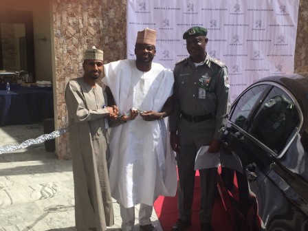 Kunle Afolayan with Ibrahim Boyi, MD, PAN and an officer of Nigerian Air Force as he received his official car. 