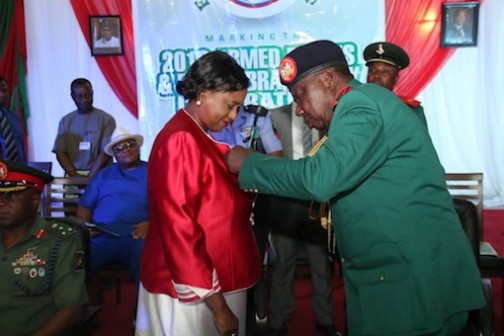 Rivers Deputy Governor, Dr. Iaplibo Harry Banigo decorated by the Chairman Nigeria Legion Rivers State Command Col. Wilberforce Josiah during the 2016 Armed Forces Remembrance Day at the Dr. Obi Wali conference centre, Port Harcourt.