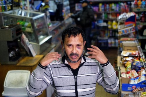 Muslim shopkeeper Sarkar Haq, who was beaten in an alleged hate crime, speaks during an interview at his shop in New York on December 7, 2015 (AFP Photo/Jewel Samad) 