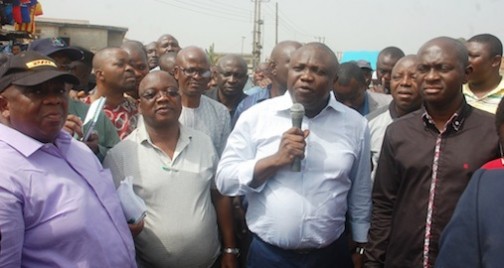 L-R: Lagos State Governor, Mr. Akinwunmi Ambode (2nd right), addressing the residents of Alfa Nla, Oke-Koto, Agege, during his  inspection of the newly rehabilitated Alfa Nla Road, Agege,  on Thursday, December 24, 2015. With him are Commissioner for the Environment, Dr. Babatunde Adejare; Commissioner for Works & Infrastructure, Engr. Ganiyu Johnson and Commissioner for Energy & Mineral Resources, Mr. Wale Oluwo