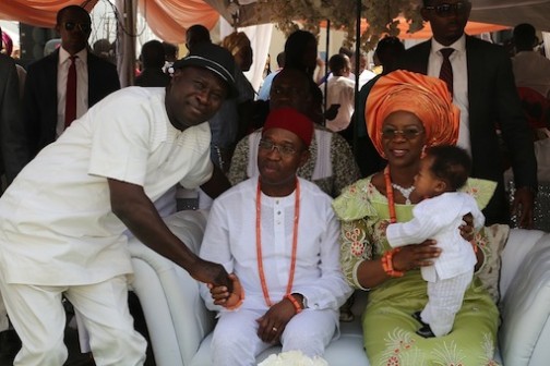 Delta State Governor, Senator Ifeanyi Okowa (middle); his wife, Edith, cuddling their grand child and Chief Tunde Smooth during marriage ceremony