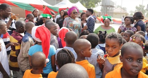 Wife of Lagos State Governor, Mrs. Bolanle Ambode with the  Managing Director, Lagos State Parks & Gardens Agency (LASPARK), Dr. (Mrs.) Titilayo Anibaba, dancing with children, during the LASPARK 2015 Christmas Family Fun Share celebration at the Ndubuisi Kanu Park, Alausa, Ikeja, on Tuesday, December 15, 2015.