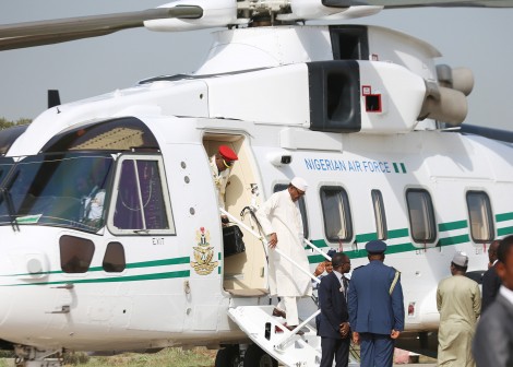 Buhari alights from a helicopter