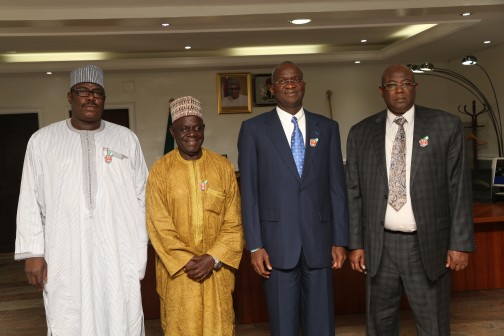Hon. Minister of Power , Works and Housing , Mr Babatunde Fashola SAN (2nd right) , the Hon. Minister of State in the Ministry, Hon. Mustapha Baba Shehuri (2nd left) , the Permanent Secretary , Works and Housing , Engineer Abubakar Magaji (right) and the National Chairman, Nigerian Legion, Colonel Micah Gaya (rtd.) in a group photograph shortly after being decorated with the Armed Forces Remembrance Day Celebration Emblem 2016  by Col. Gaya at the  Honourable Minister’s Office ,Ministry of Works Headquarters , Mabushi, Abuja, FCT on Wednesday, December 9, 2015.