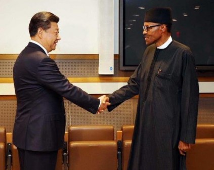President Xi Jinping of China shake hands with President Muhammadu Buhari of Nigeria