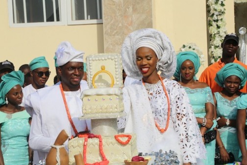 Former Miss Merlyn Okowa (daughter of Governor Ifeanyi Okowa) and Mr Gbolahan Daramola cutting their marriage cake