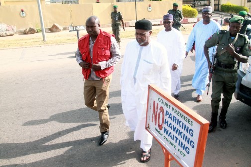 Former NSA Sambo Dasuki with Salisu Shuaib, former Director of Finance and Admin [in blue] and Aminu Baba, former NNPC Director on arrival at the High Court of Federal Capital Territory, Abuja on Monday morning, 14 Dec. 2015. Photos: Femi Ipaye 