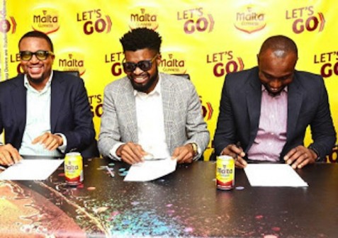 Comedian Bright Okpocha (M) signs contract as ambassador for Malta Guiness 