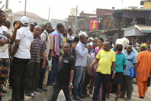 Group of shop owners after their shops gather after demolition of their shops at Oshodi on Wednesday Photo: Idowu Ogunleye