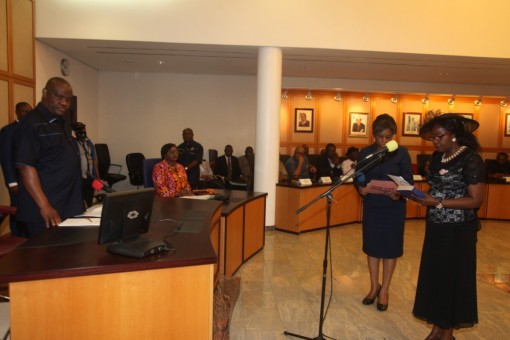 Justice A. I. Iyayi Laminkanra (right) take Oath of office as the acting Chief Judge of Rivers State while Governor Nyesom Ezenwo Wike watches at the Executive Chambers of Government House.