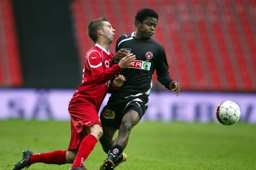 Izunna Uzochukwu (right) in action for Amkar Perm during a   match in the Russian League