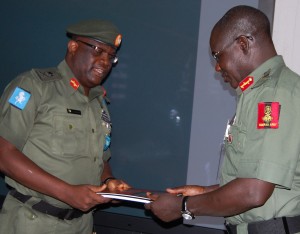 Major-General-Adeniyi-Oyebade-GOC-1-Division-submitting-report-to-Chief-of-Army-Staff-Lieutenant-General-Tukur-Yusuf-Buratai