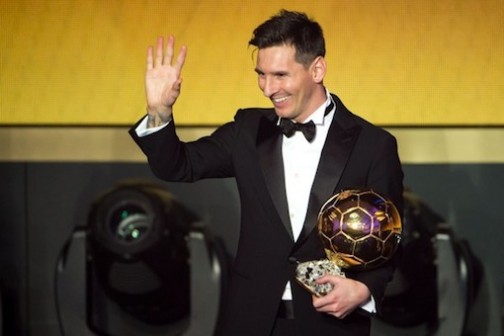 FILE PHOTO: Lionel Messi poses with his unprecedented fifth Ballon d'Or award
