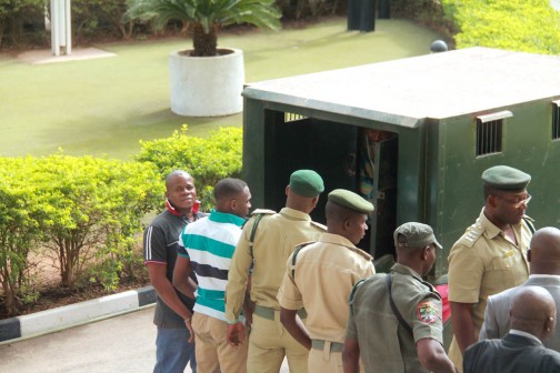 Nnamdi Kanu and the two others charged with him arriving the Federal High Court, Abuja on Monday morning  with prison warders 