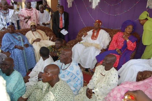 Oba Aromolaran II surrounded by chiefs and his followers