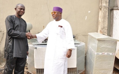 Lagos State Commissioner for Energy & Mineral Resources, Mr. Wale Oluwo (left) with the Chairman, Resident Association of PalmGroove Estate, Capt. Jide George, during the handing over of a 500KVA Transformer to the Resident by the Lagos State Government, on Saturday, January 30, 2016