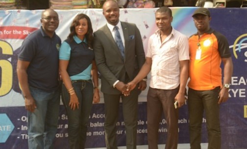 L-R: Business Development Manager, Eziukwu Road Branch , Aba, Chinedu Oguejiofor, Head, Retail Banking ,Nkolika Okoli, Regional Director , South East 2, Chukwudi Onuegbu, Winner, N250,000 at Ariaria Market today, A businessman, Chinonso Ezeanya and Assistant Manager, National Lottery Regulatory Commission, Opara Celestine at the  Bank's “Reach For The Skye”  reward draw held in Ariaria International  Market, Aba in Abia State today, 21st January, 2016