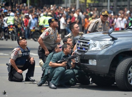 Indonesian police aiming at the attackers today. AFP