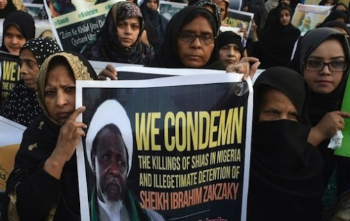 FILE PHOTO: Pakistani Shiite Muslims carry placards of Ibrahim Zakzaky, a Nigerian Shiite radical who wants to set up an Islamic Republic, at a protest against the killing of Shiite Muslims in Pakistan and Nigeria, in Lahore on December 18, 2015 ©Arif Ali (AFP/File)