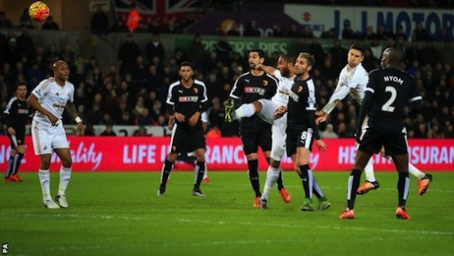 Captain Ashley Williams strikes for Swansea in front of new manager, Francesco Guidolin