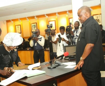 Rivers State Governor, Nyesom Wike swearing-in the  State Chief Judge, Justice Daisy Okocha at the Executive Council Chamber of Government House, Port Harcourt