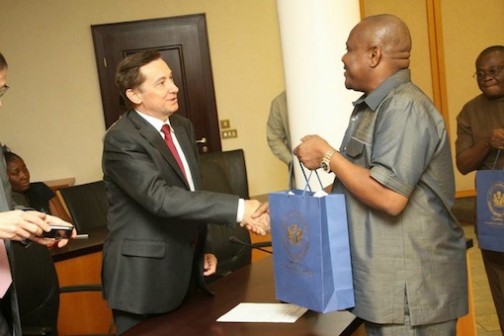 R-L: Governor Nyesom Wike of Rivers State presents a gift to Denys Gauer