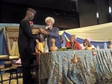 Wole Soyinka presented vodka and other gifts to Biodun Jeyifo while others watch in admiration