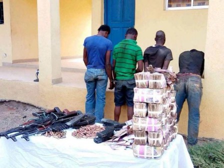 The arrested robbers and their loot
