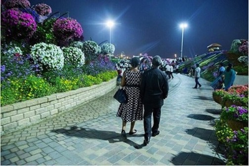 Nigeria's vice president, Prof Yemi Osinbajo (R) and his wife, Dolapo walking on a street in Dubai