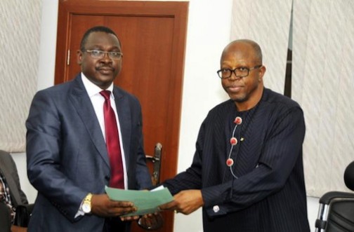 Former Director-General, BPP, Emeka M. Ezeh (R), handing over to Babatunde Kuye