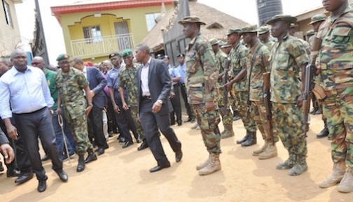 Lagos State Governor, Mr. Akinwunmi Ambode (left), with the members of Operation Awaste, during his Security inspection tour of Owotu, Isawo, Oke Oko and Adjourning Communities in Ikorodu West Local Council Development Area, Ikorodu, Lagos, on Tuesday, February 16, 2016