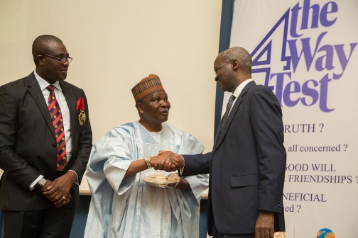 Minister of Power, Works & Housing and Chairman of the Occasion, Mr Babatunde Fashola, SAN (right), presenting an Award of Honour to former  Head of State , General Yakubu Gowon (middle),  with the Governor, Rotary International District 9126, Dr. Mike Omotosho (left) during the Unveiling of the 4Way Test Initiative, organized by the Rotary International District 9126 at the Yar'Adua Centre, Abuja on Tuesday, 23 Feb., 2016.