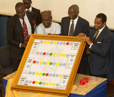 Minister of Power, Works & Housing and Chairman of the Occasion, Mr Babatunde Fashola, SAN (2nd right),the  Special Guest of Honour, General Yakubu Gowon (2nd left), former Governor of Cross River State , Mr Donald Duke(right) and Governor, Rotary International District 9126, Dr. Mike Omotosho (left) present the 4Way Test Game during the Unveiling of the 4Way Test Initiative, organized by the Rotary International District 9126 at the Yar'Adua Centre, Abuja on Tuesday, 23 Feb, 2016.