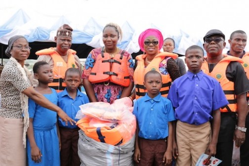 R-L: Wife of Lagos State Governor, Mrs. Bolanle Ambode (2nd right), Representative of Commissioner for Transportation, Engr. Adebola Matanmi; Managing Director, Lagos State Waterways Authority (LASWA), Ms. Abisola Kamson; Executive Secretary, Epe Local Government, Hon. Hammed Seriki and a teacher in Epe LG, during the distribution of Life Jackets to students and pupils in Epe Local Government as part of Campaign of Water Transport Safety Awareness Programme, organized by LASWA in partnership with Total Nigeria Limited, on Wednesday, February 17, 2016
