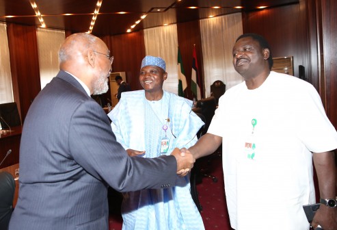 L-R;  Senior Advisor Economic Office, United States Institute of Peace (USIP), Mr Johnnie Carson, exchange greetings with SSAP, on Media and Publicity, Mallam Garba Shehu and Special Adviser on Media and Publicity to the President, Mr Femi Adesina during an audience with USIP and the President at the State House in Abuja. PHOTO; SUNDAY AGHAEZE/STATE HOUSE. FEB 15 2016