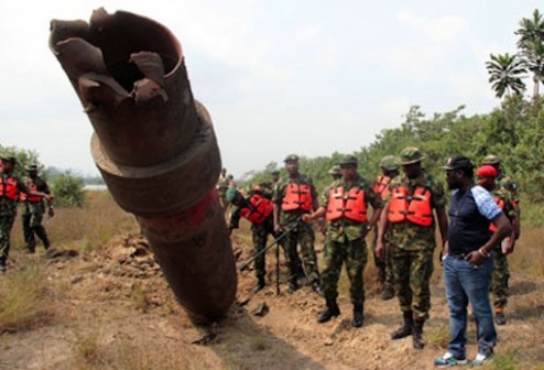 FILE PHOTO: A  pipeline destroyed by Niger Delta militants now known as 'Avengers'