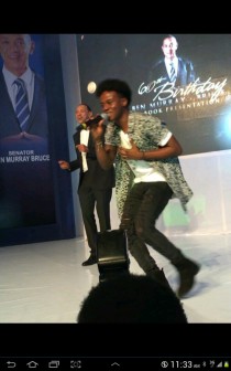 Bruce on stage dancing to Korede Bello's Godwin