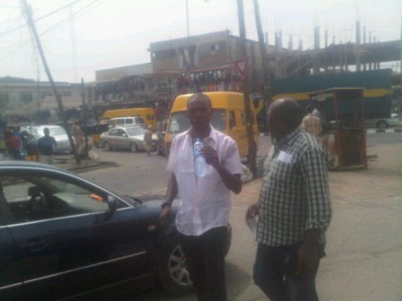 Tony Benson(left) tracked down at Ikeja by police detective Alagbo (right)