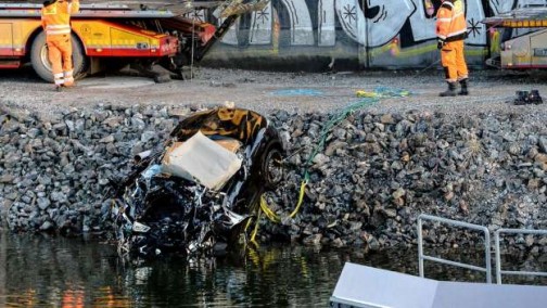 Wrecked car driven by Viola Beach being  towed from the canal under the E4 highway bridge in Stockholm. PHOT: AFP 