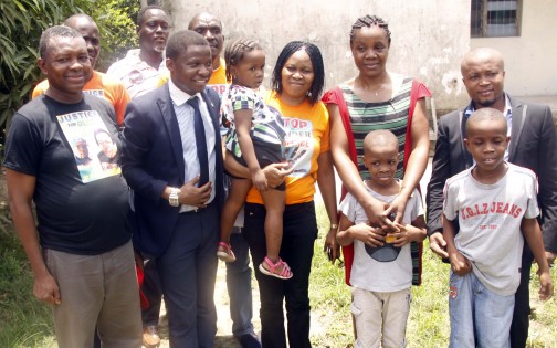 L-R: Sec.Gen. Campaign For Democracy, Comrade Goodluck Obi;  Women Arise lawyer, Barr. Christian Love; President Women Arise, Dr. Joe Okei-Odumakin; GBV survivor, Mrs. Gloria Izuakor; her husband, Mr. Jude Izuakor and the couple' children at the re-union of the Izuakors  after the domestic violence, witnessed at Magistrates' Court, Kirikiri, Lagos, Wednesday, 23 March, 2016