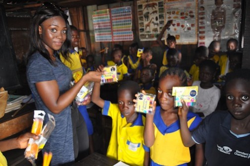 Oluwaseun Olufemi  shares some fun moment with pupils of Whanyinna Nursery and Primary School Makoko Water Front, Yaba Lagos