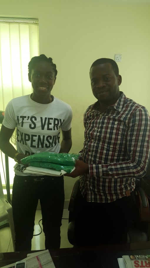 Super Falcons player, Asisat Oshoala (left) receiving a gift from Executive Director Winners Golden Bet, Mr. Olabanji Sulaiman during Oshoala’ visit to the company recently.