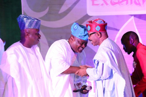 Speaker of the Lagos State House of Assembly Rt. Hon. Mudashiru Obasa (middle) in handshake with Dr. Olorunimbe Mamora (right) while Senator Babajide Omoworare looks on during the presentation of the award for the Most Outstanding House of Assembly to LSHA on Sunday by Global Excellence Magazine in Lagos.
