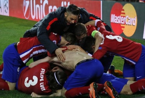 Atletico players celebrate their hard earned win