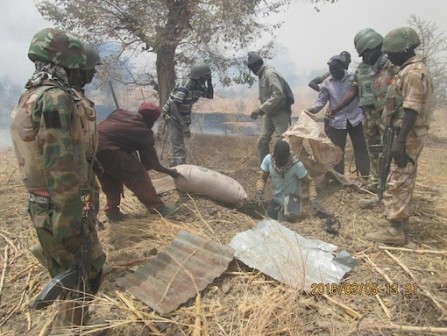 Nigerian Troops unearthing materials buried by Boko Haram